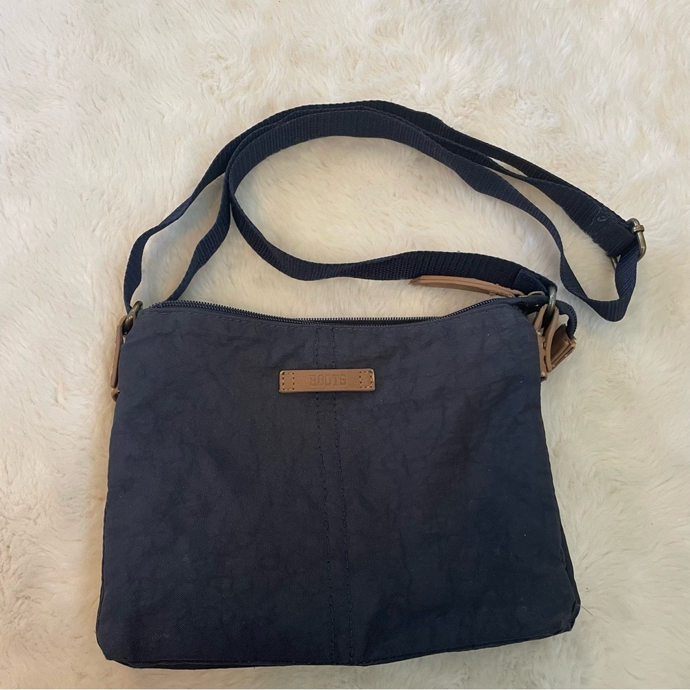 Roots cross body bag